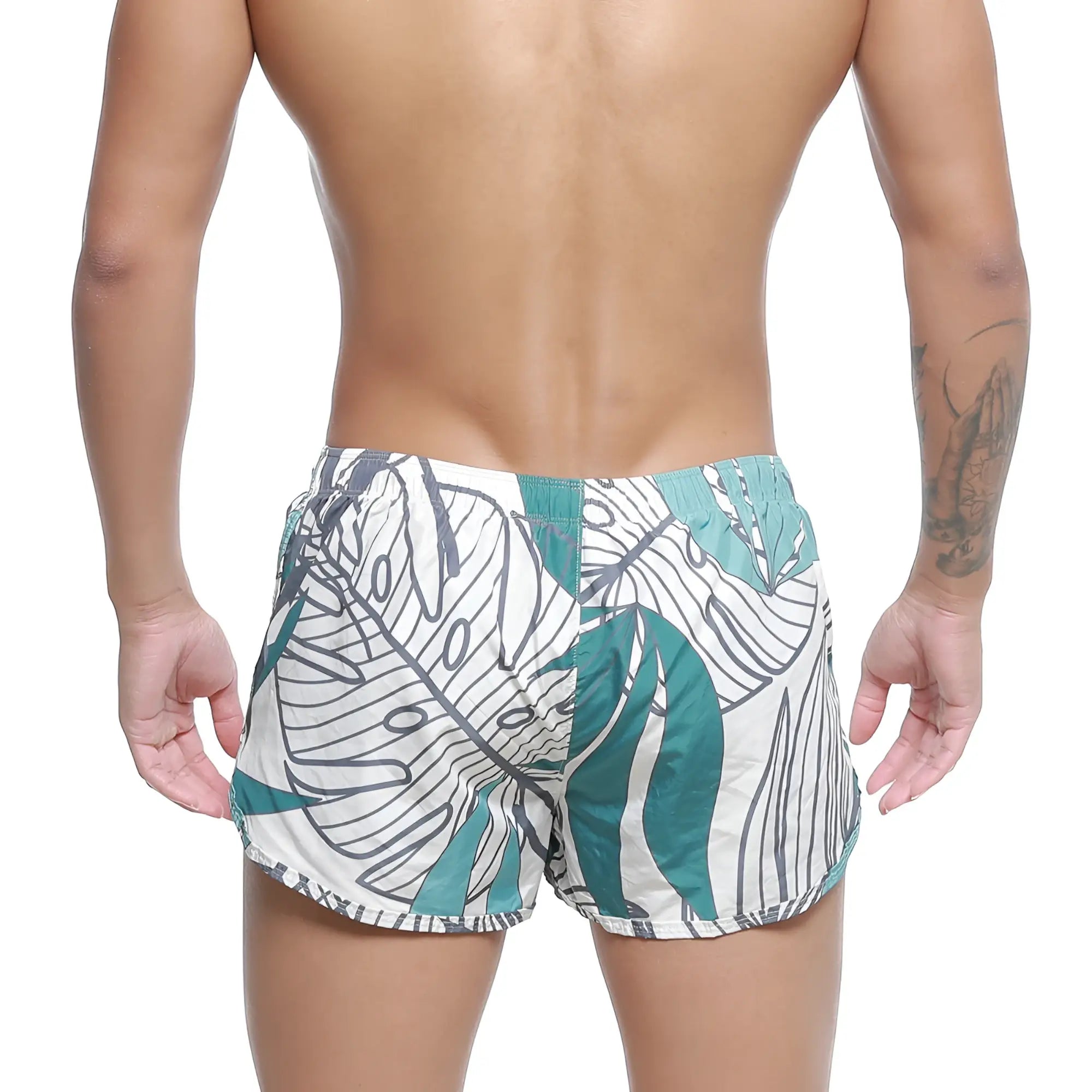 MetroMaleWear summer swim shorts meadow 4988-09 white trunks with bold teal tropical leaf pattern and black outlines