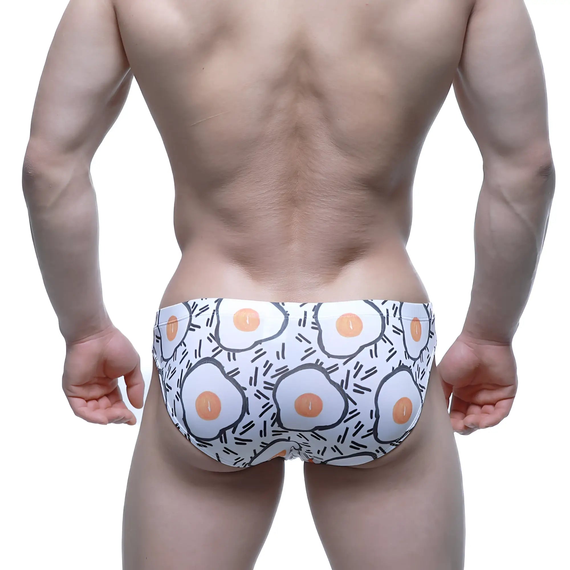 White swim trunks with playful cartoon fried egg pattern by MetroMaleWear Sunny Side Bikini 5103-M55