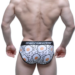 White briefs with cartoon fried eggs pattern and metroewear logo on waistband metro malewear sunny side brief 5203-64