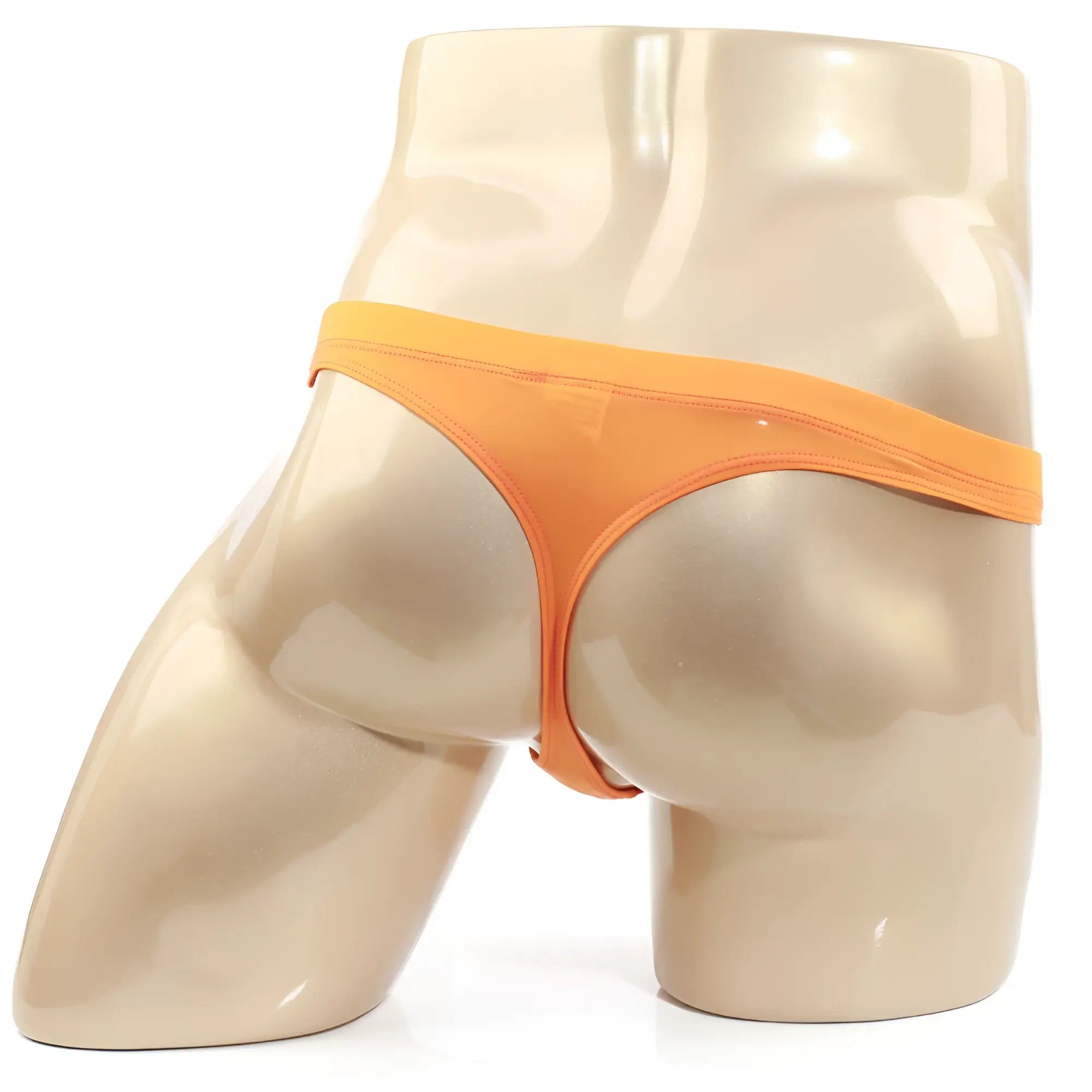 Metro male wear tasman orange thong displayed on mannequin highlighting its vibrant color and sleek design