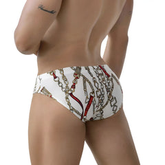 White briefs metro malewear tiki bikini 5103 89 with bold gold and red chain pattern on white fabric