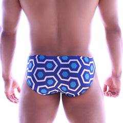 Blue and white geometric patterned swim trunks with retro hexagonal design metroMalewear Vasco hip brief