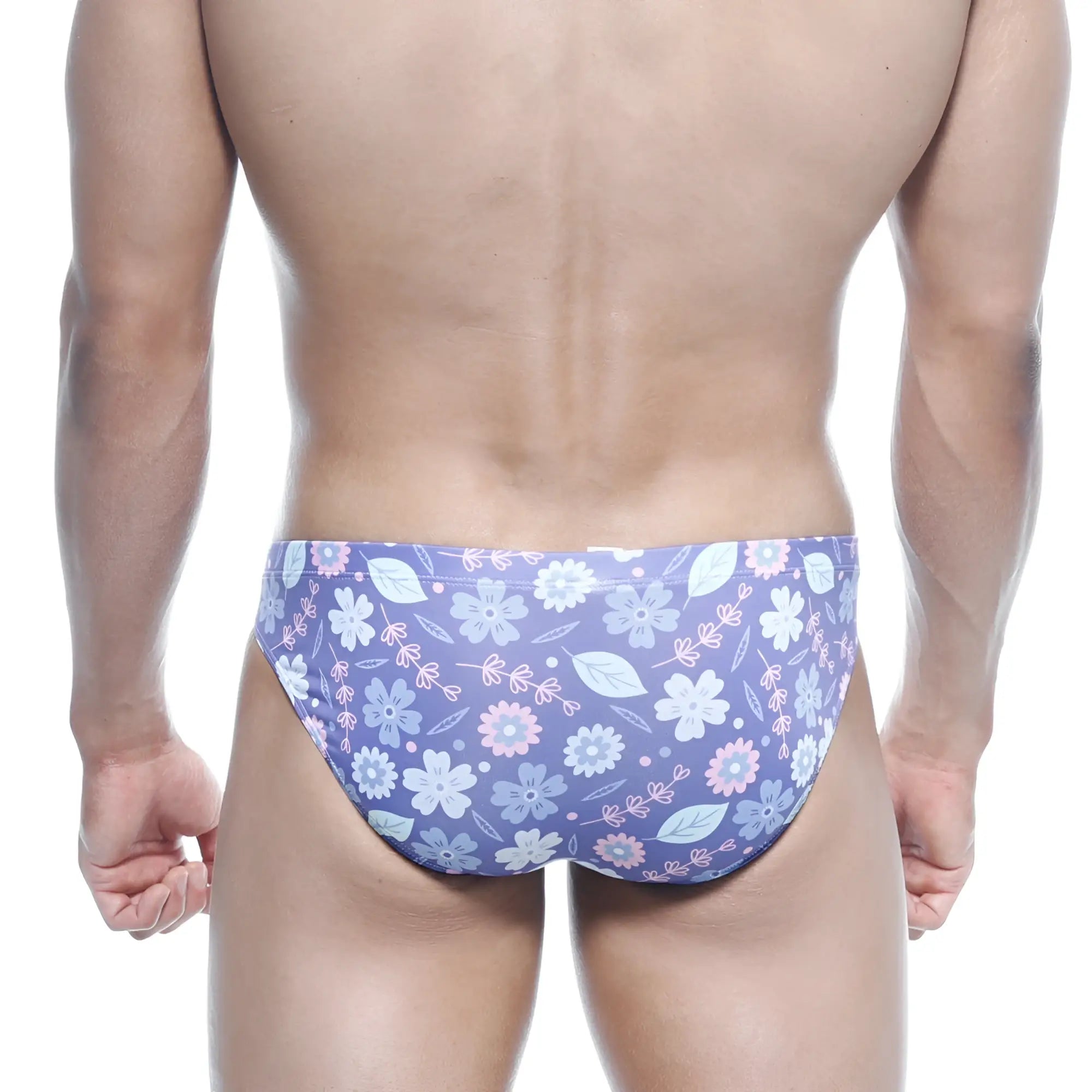 Purple floral swim trunks with light blue and pink blossoms on soft stretchy fabric by metromalewear vasco hip brief jardin