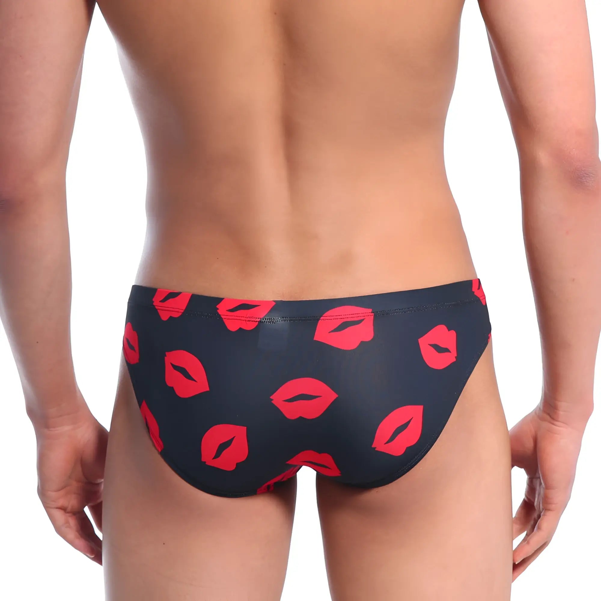 Black swim trunks by metromalewear featuring a bold red lipstick print for stylish beachwear use