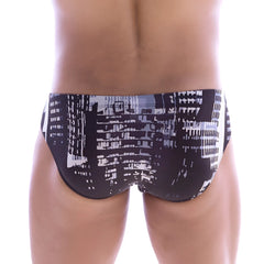 Black MetroMaleWear Vasco hip brief swim trunks with bold white and gray stylized cityscape print front view