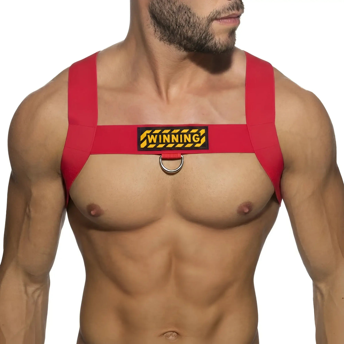 Red fabric MetroMaleWear winning harness with yellow black patch and metal ring for secure wearable use