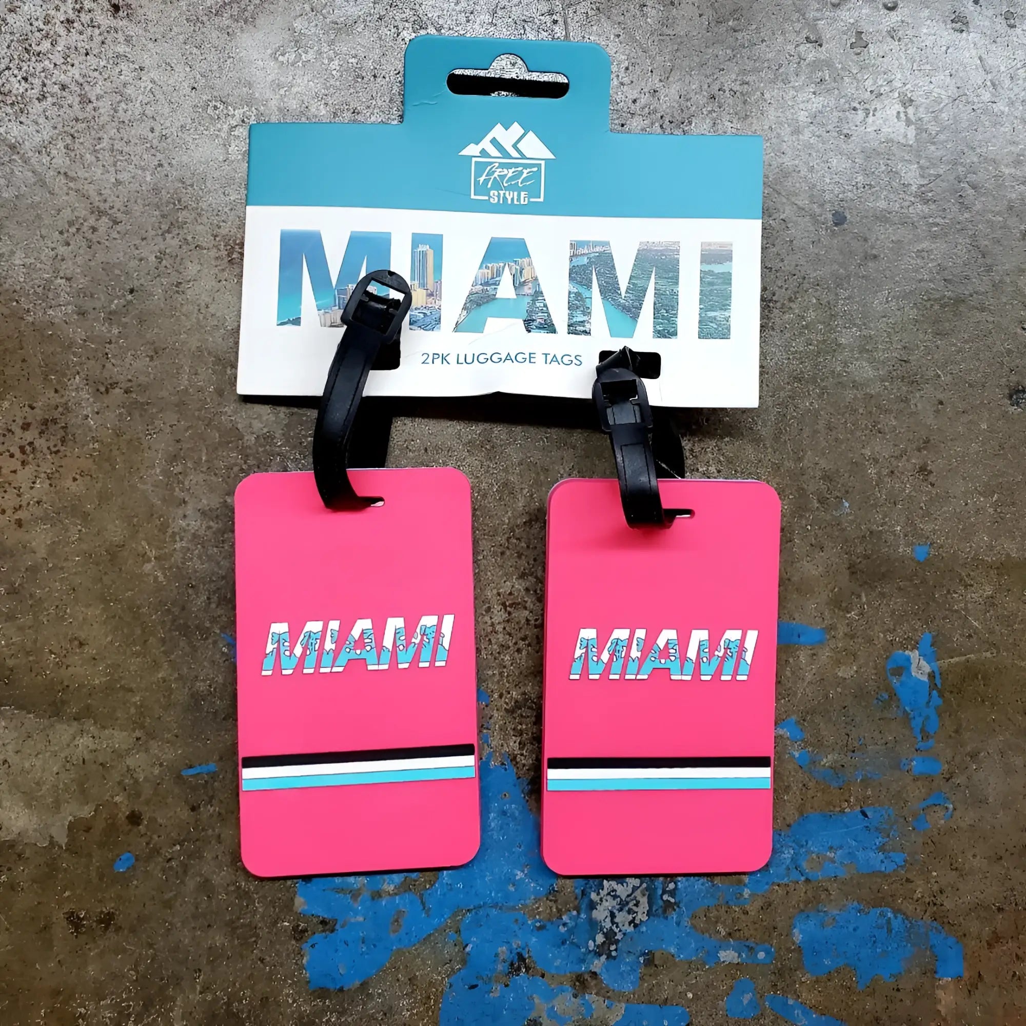 Bright pink rectangular miami luggage tags set of 2 with bold white text and black light blue turquoise stripes