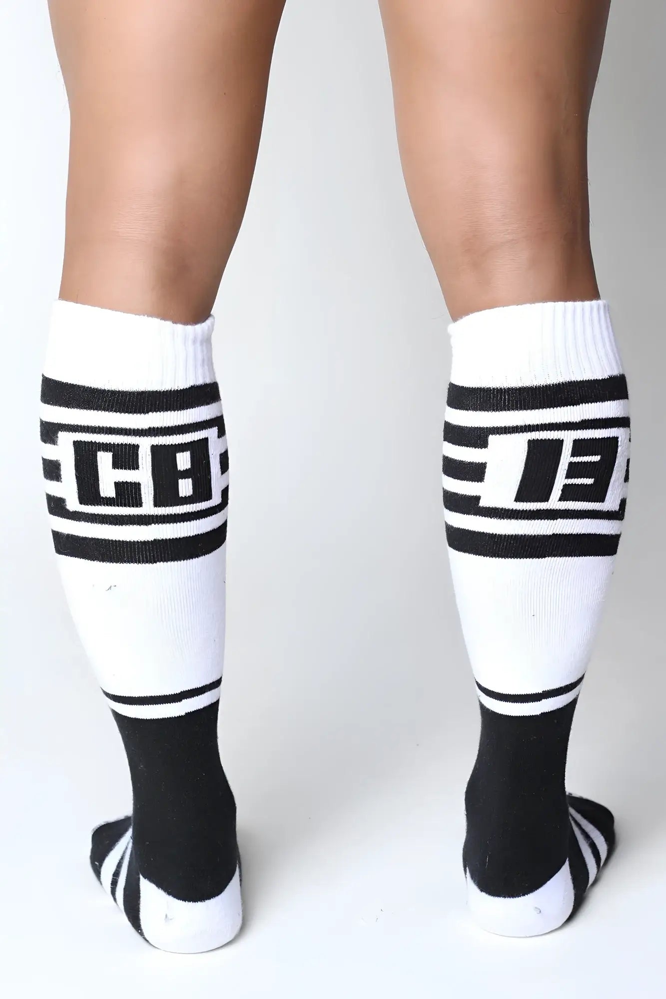 Black and white midfield knee high socks with bold stripes and cb logo for stylish athletic wear in 7 colors