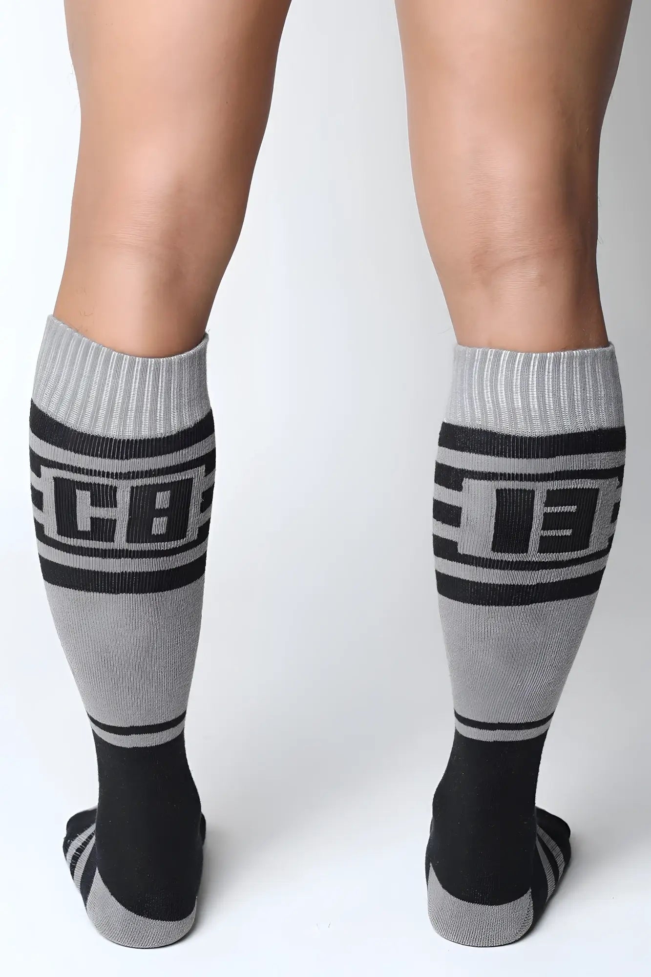 Midfield knee high socks in gray and black with bold cb lettering ribbed cuffs and toe accents for athletic use