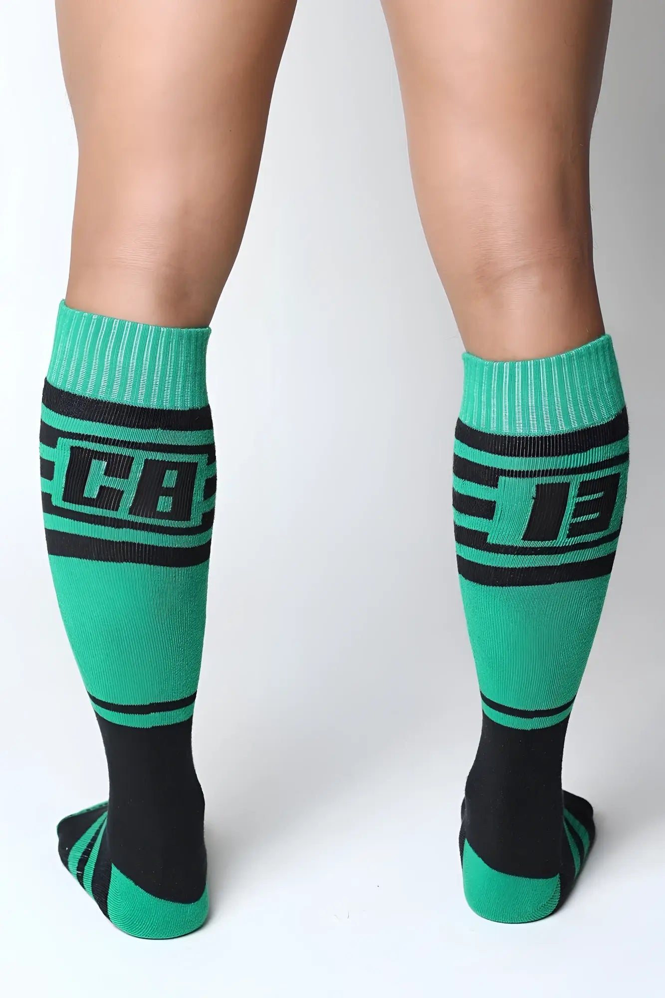 Midfield knee high socks in green and black with bold lettering on the calf made for athletic use