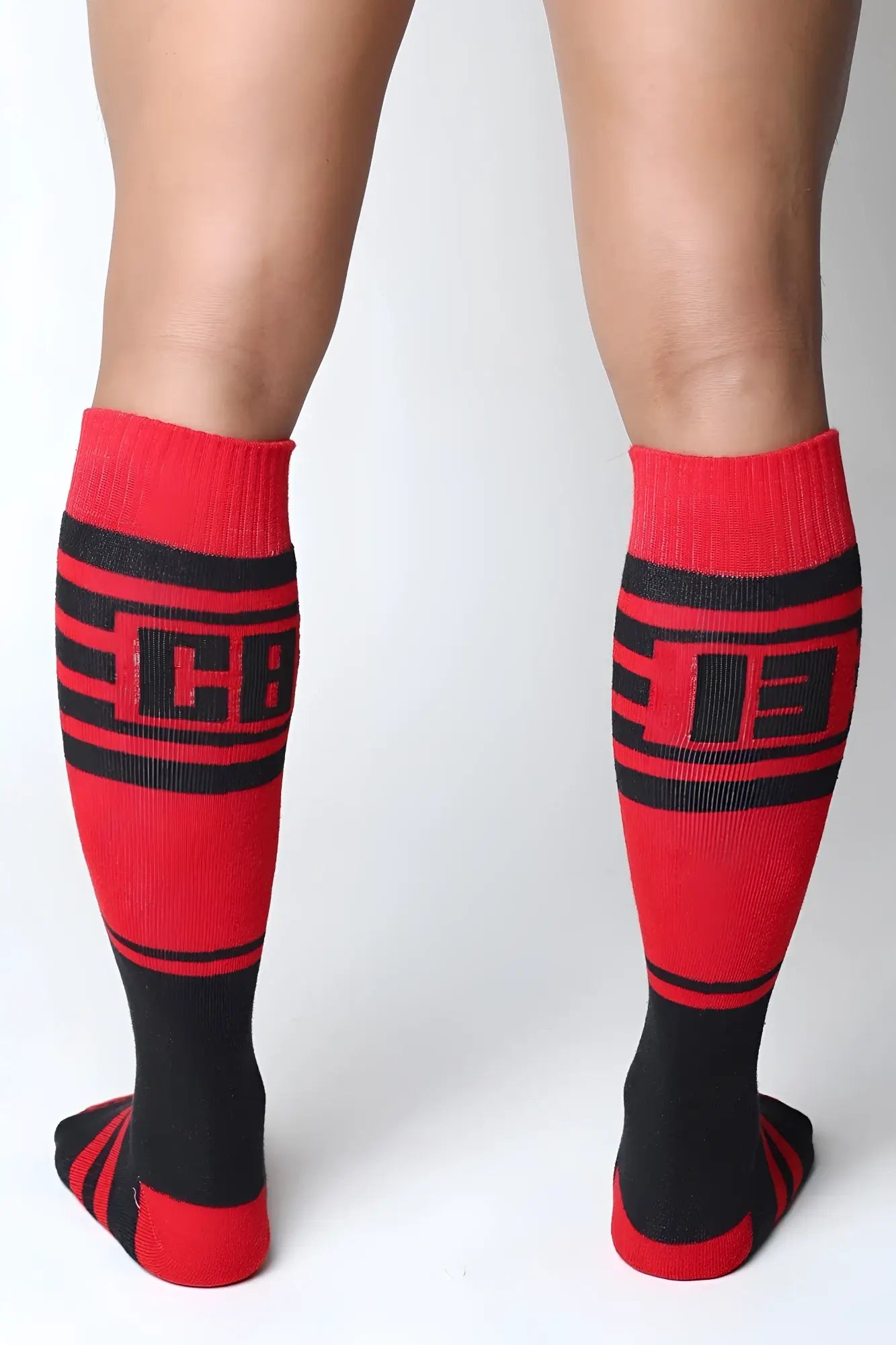 Midfield knee high socks with bold red and black horizontal stripes and a prominent cb logo on the calf