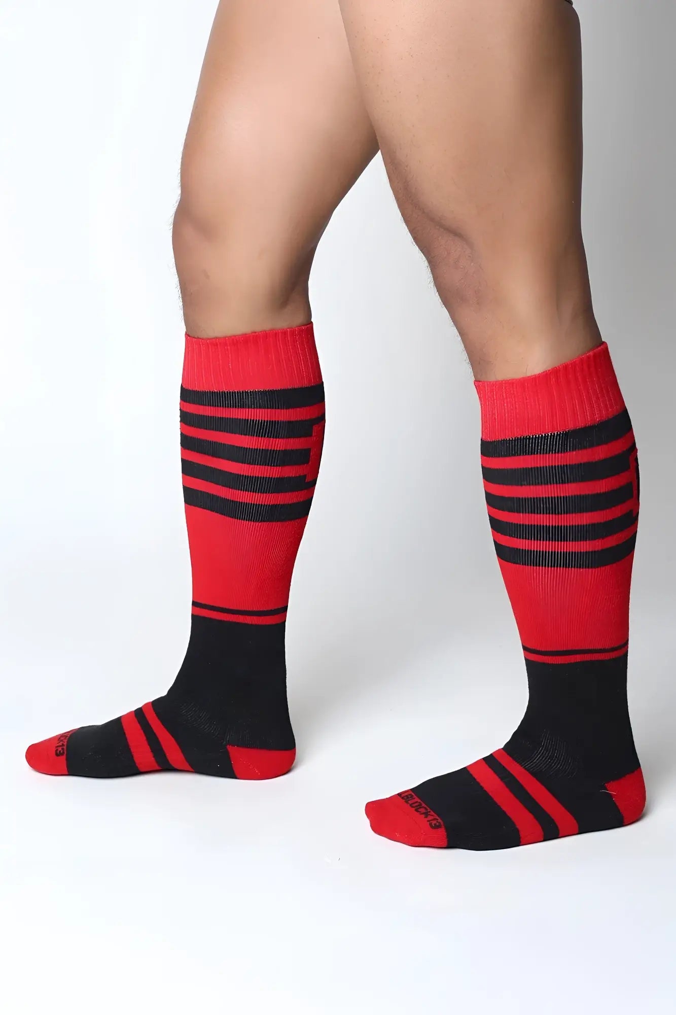 Midfield knee high sock in red and black stripes with ribbed texture for comfortable all day wear