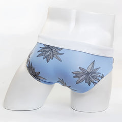 Light blue men’s briefs with white waistband and black and gray cannabis leaf pattern from MIIW floral beach bikini swimwear