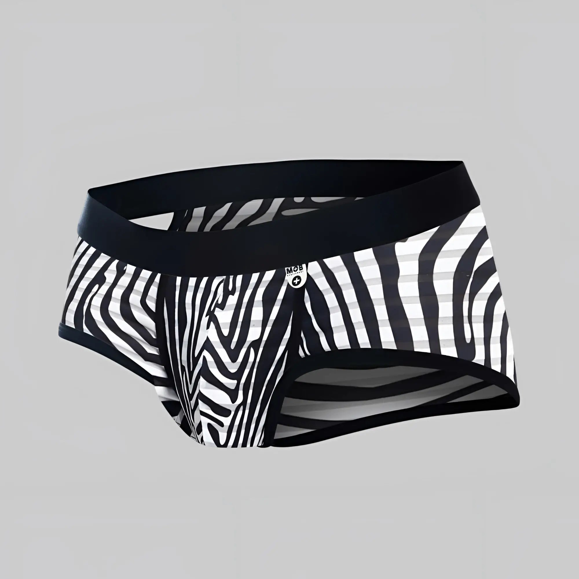 Black and white zebra striped men’s briefs with solid black waistband from mob aero brief collection