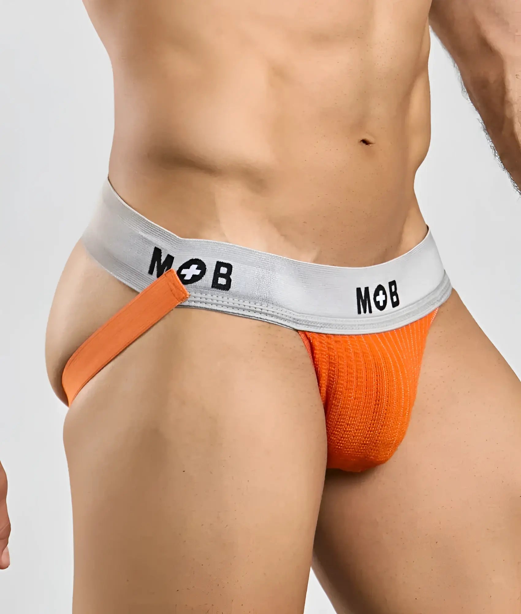 Orange knitted MOB Classic Jock 3 inches briefs with a gray waistband featuring the mob logo in black lettering