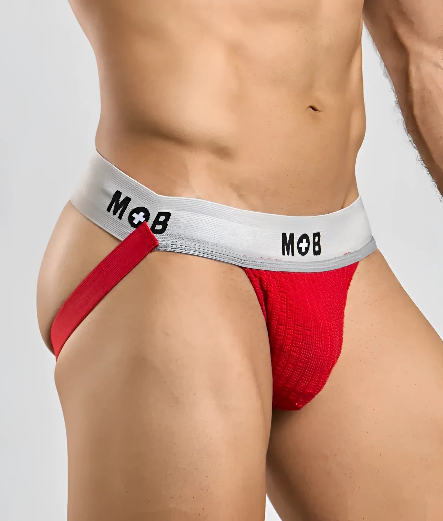Red textured briefs with a gray waistband featuring the mob logo in black from the mob classic jock 3 inches collection