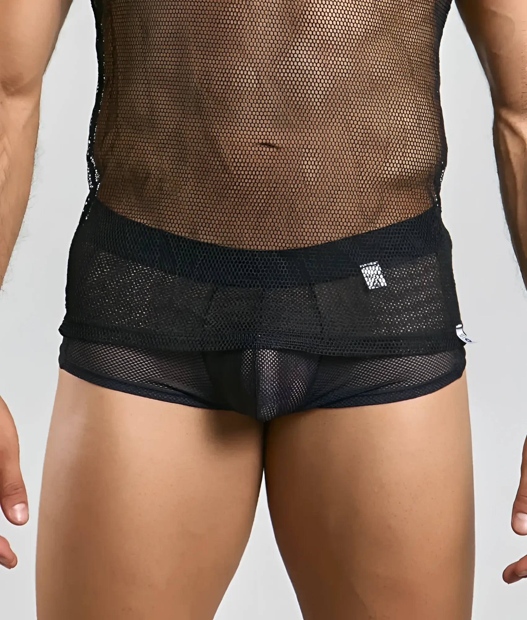 Black mesh briefs with solid black waistband and subtle branding tag designed to complement mob fishnet tanktop
