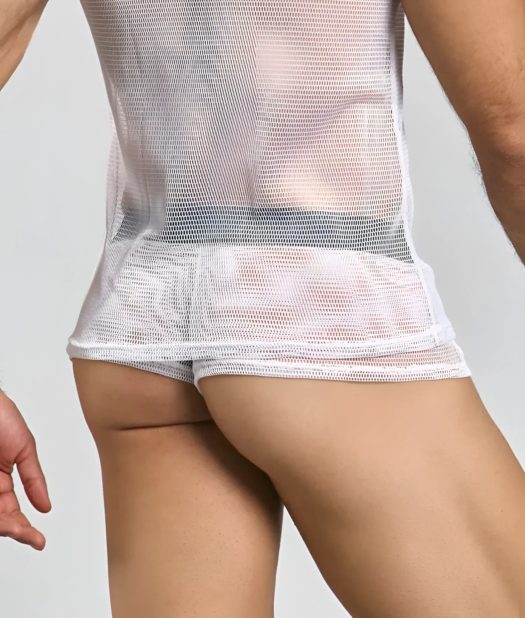 White MOB fishnet tanktop with a snug, form-fitting design made of breathable mesh material