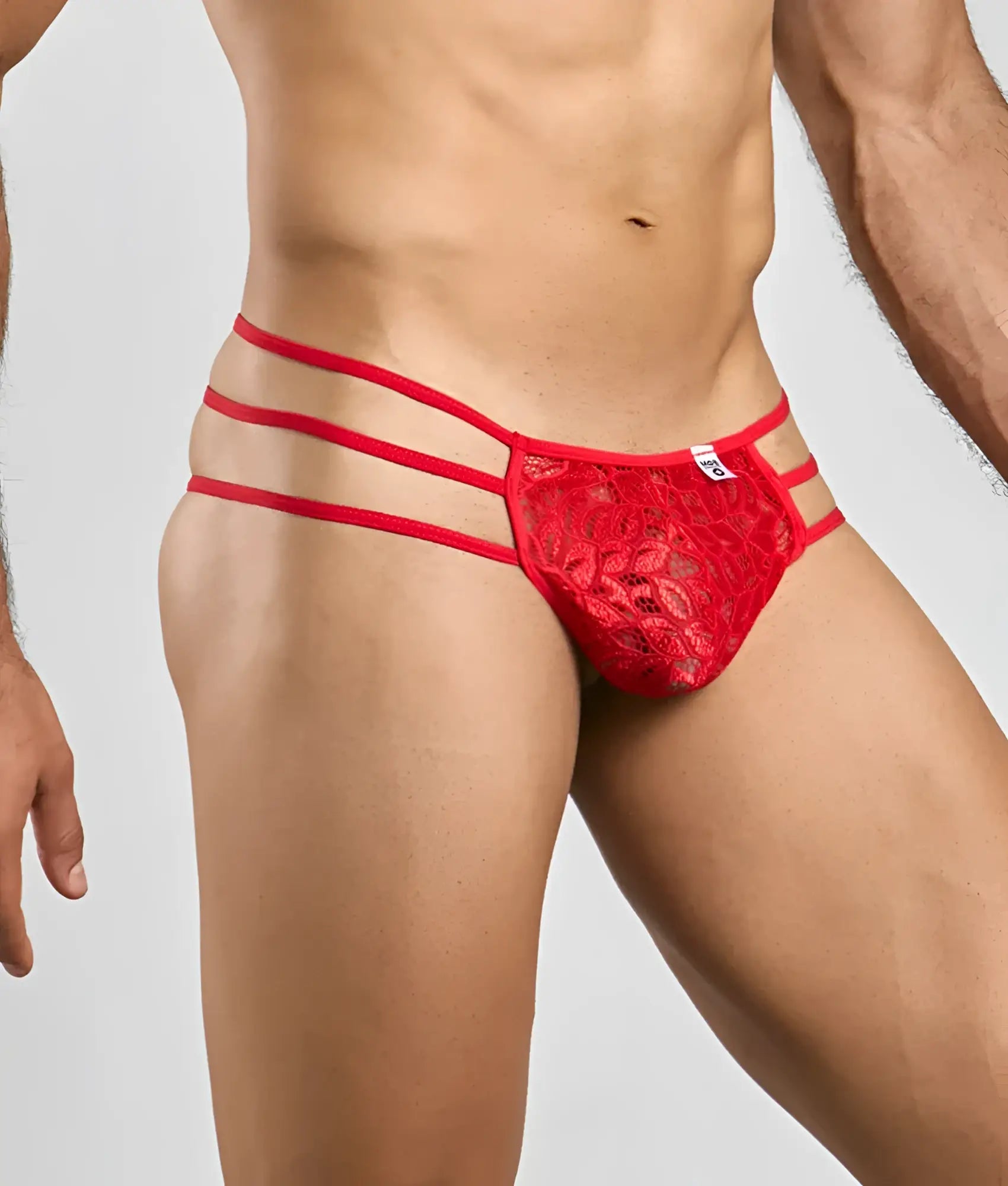 Red lace thong with three horizontal straps from mob men’s lace pouch thong collection in vibrant red lace material