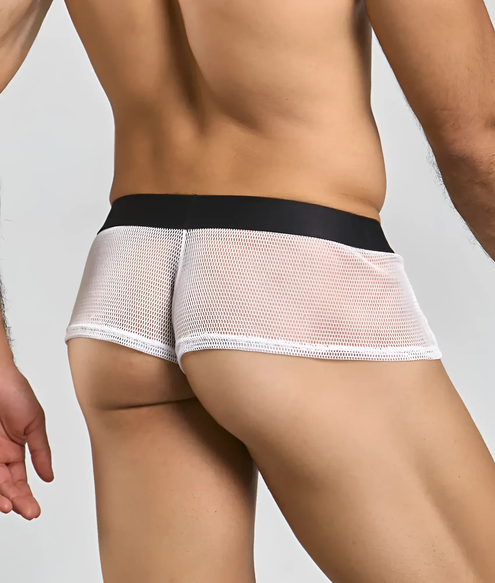White mesh briefs with a black waistband featuring fishnet material from mob fishnet boxer collection