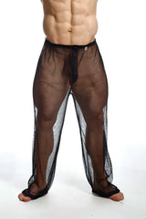 Black mesh men’s swim trunks with solid black waistband and reinforced cuffs from mob fishnet pants collection