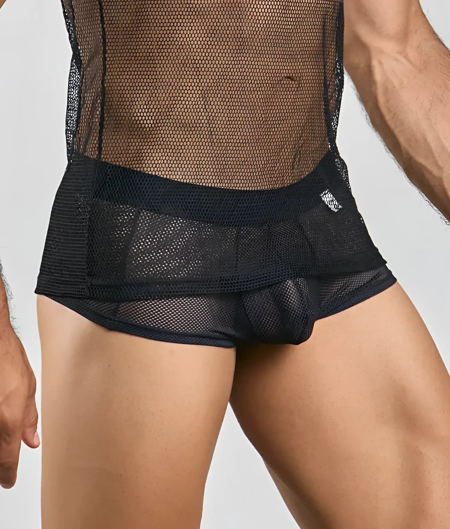 Black mesh briefs with solid black waistband and subtle ruching detail complementing mob fishnet tanktop design