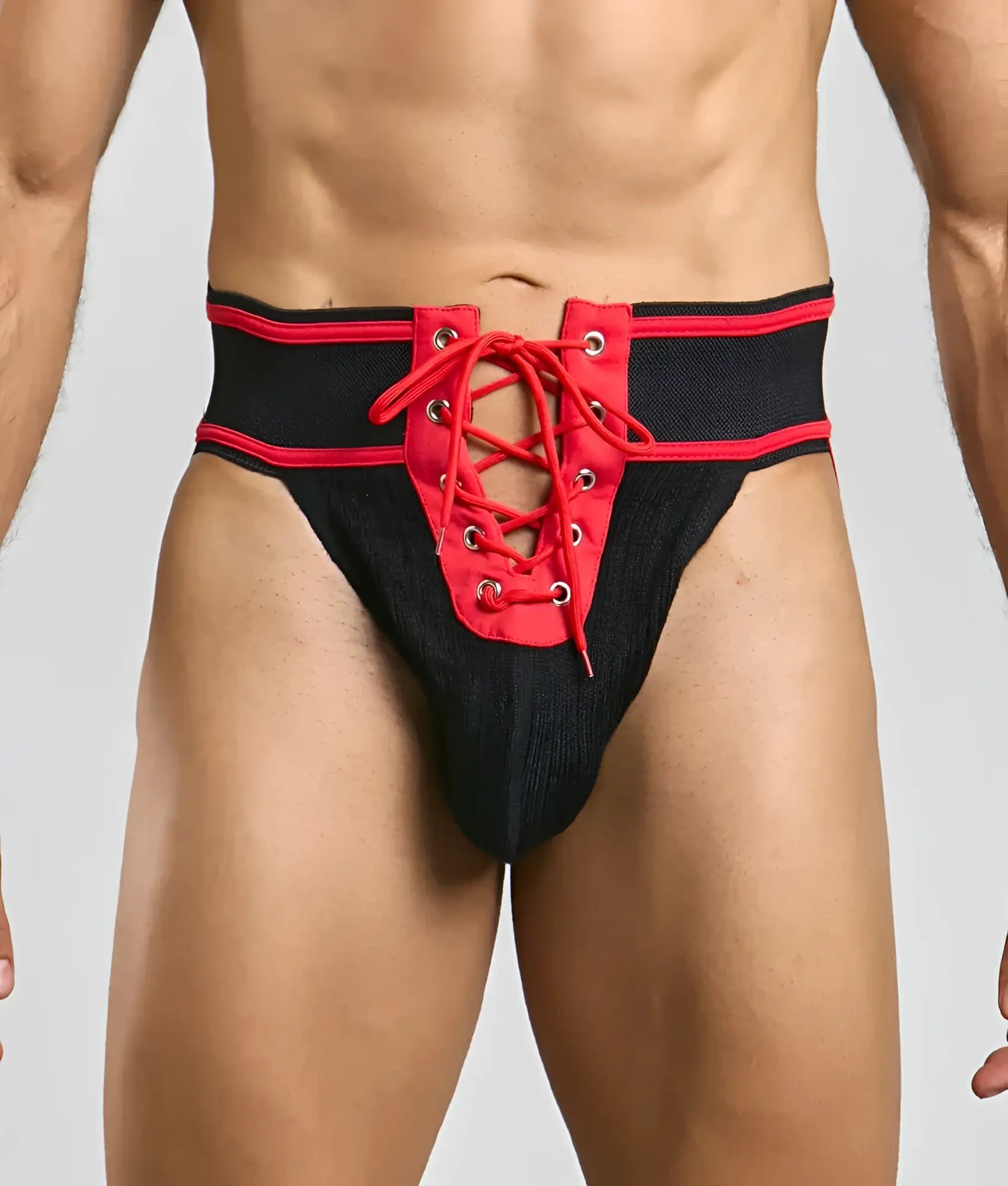 Black and red lace-up athletic briefs with textured fabric waistband for football by MOB Football Jockstrap