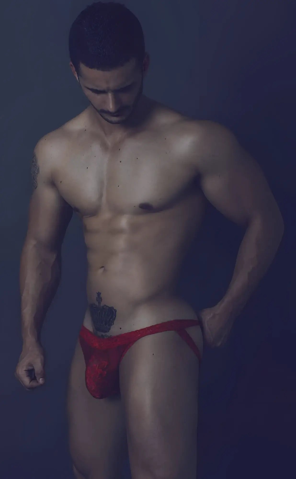 Red athletic lace jockstrap with small embroidered logo on front designed for men’s activewear by MOB