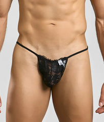 Black lace thong with thin elastic straps and a small white MOB brand tag for men