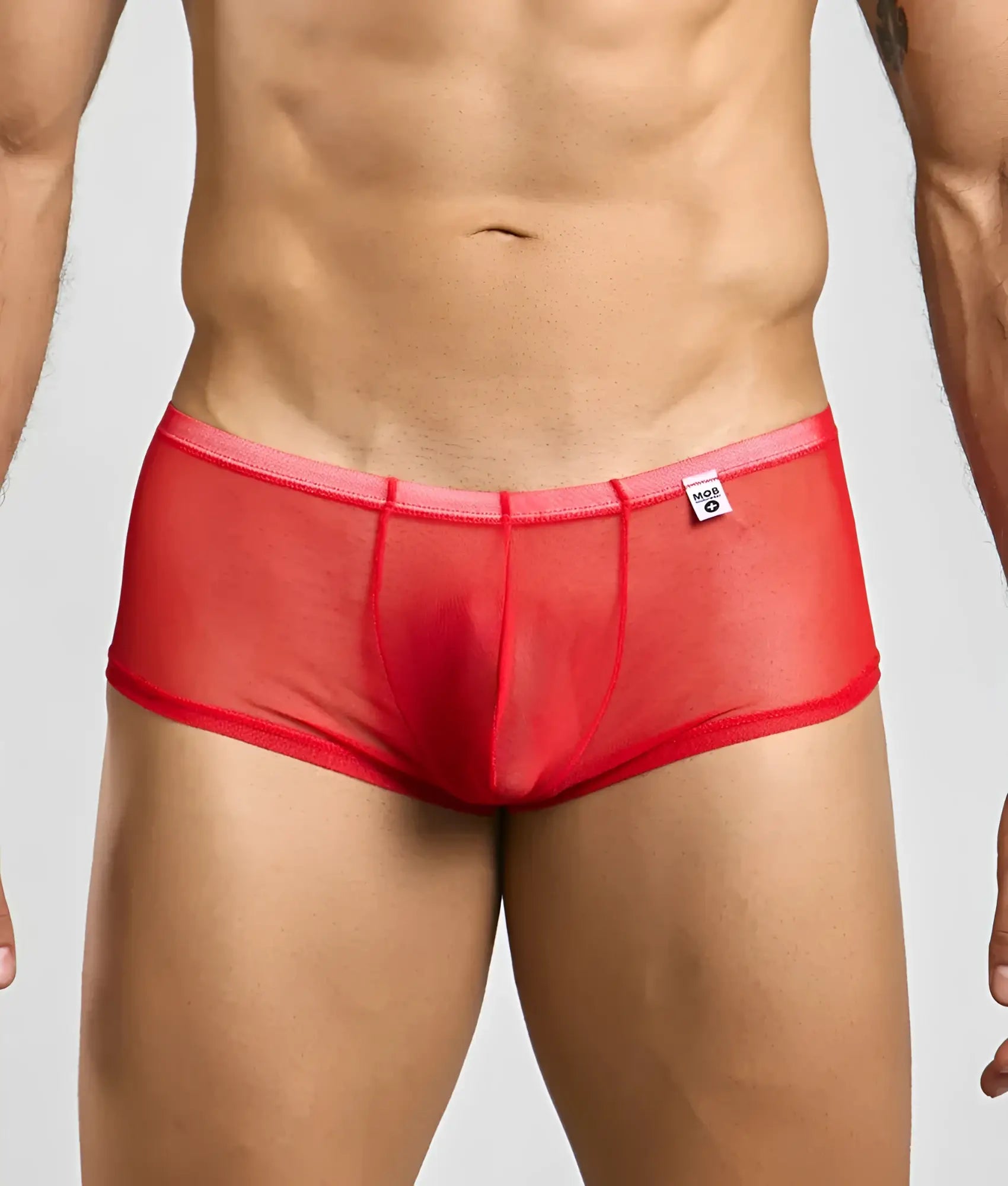 Mob men’s sexy sheer hip brief in red sheer mesh with solid waistband and white brand tag visible on front side