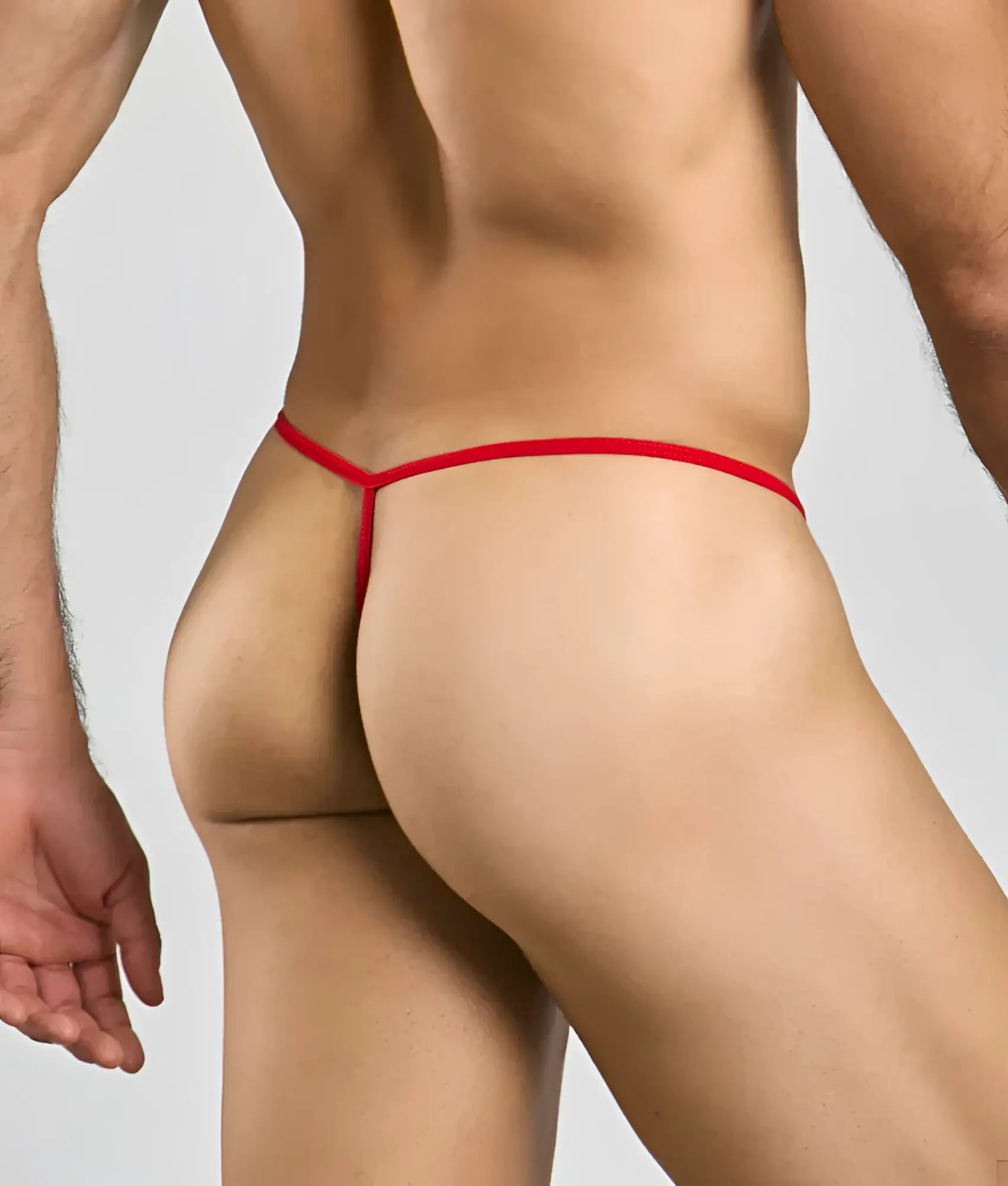 Red thong with thin smooth elastic band shown from the back in mob mens sheer t back thong product image