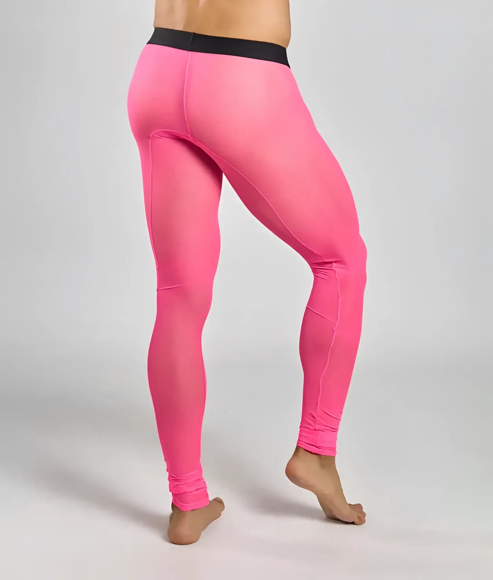 Bright pink mob mesh tights with a black waistband featuring form-fitting breathable mesh fabric