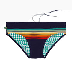 Men's swim brief in navy with horizontal stripes in green yellow orange and red geometric teal pattern inside CA-RIO-CA Sunga Co branding
