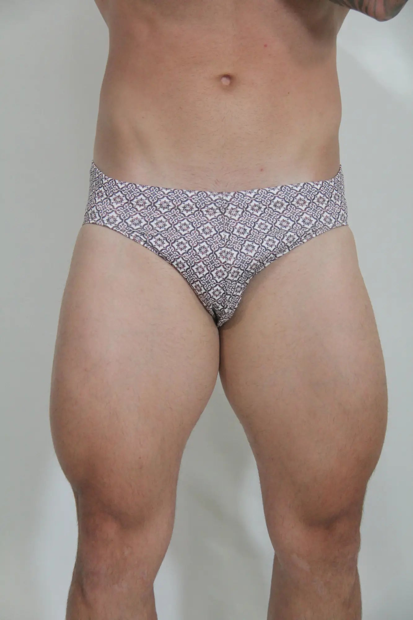 Black and white patterned MOSAICO swim brief with geometric design for comfortable beachwear use
