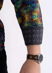 Multicolor patterned long sleeve shirt with vibrant mandala design and dark navy cuff with intricate white geometry