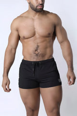 Muzzle up athletic short in black with a drawstring waistband and small logo patch on the lower right leg
