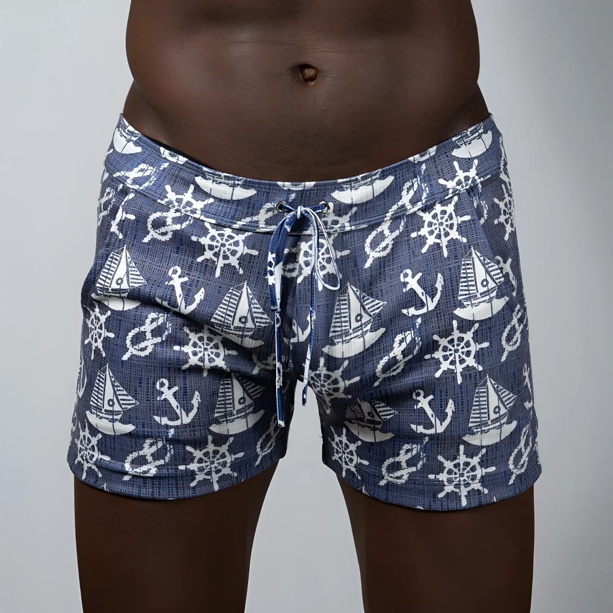 Navy blue nautical linen texture shorts with white anchor sailboat and ship wheel pattern ideal for swimwear