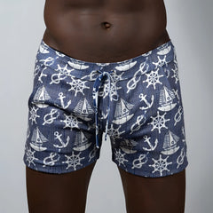 Navy blue nautical linen texture shorts with white anchor sailboat and ship wheel pattern ideal for swimwear