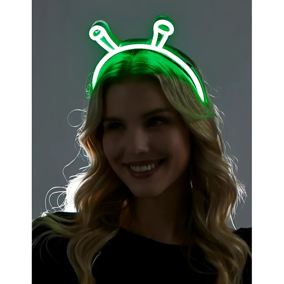 Green neon alien headband with glowing antennae made of flexible plastic for fun party wear