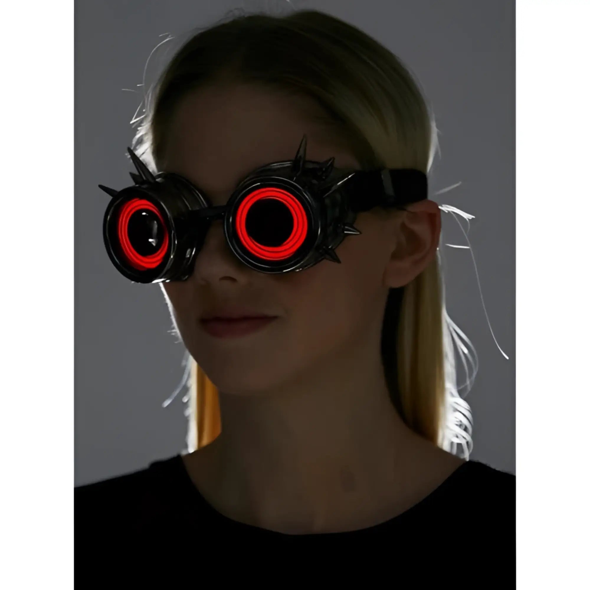 Black spiked neon light up goggles with glowing red circular lights for rave and cosplay use