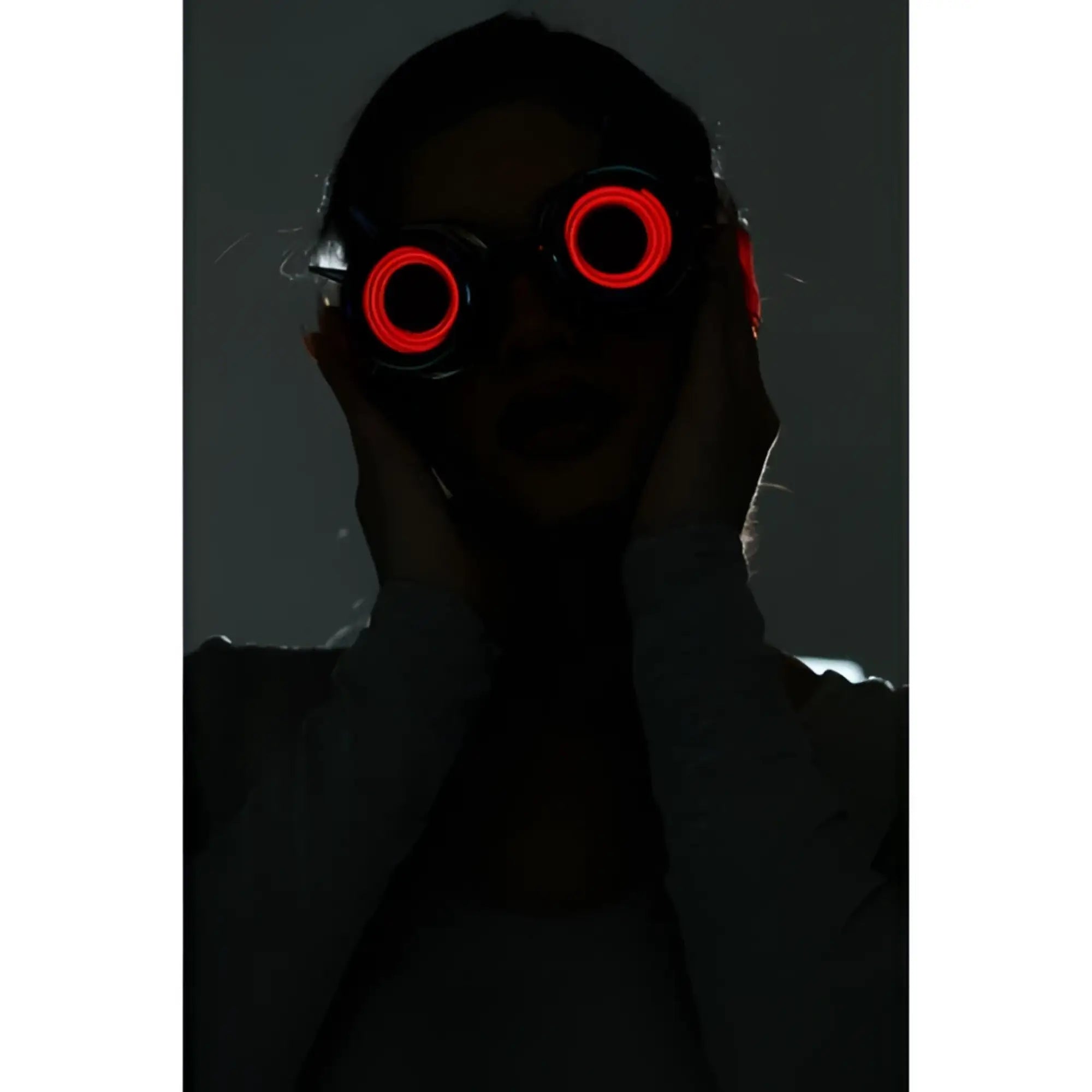 Neon light up goggles with red led-lit circular glowing lenses for vibrant night or party use