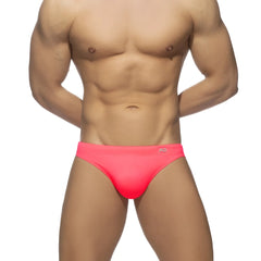 Bright pink neon swim bikini trunks with a snug fit and small waistband logo perfect for swimming