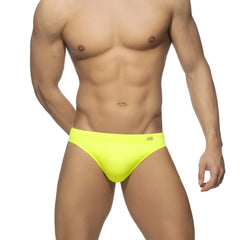 Neon swim bikini featuring bright neon yellow swim trunks with a sleek minimalist design and small waistband logo