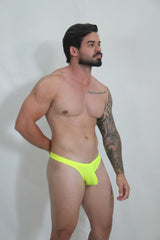 Bright neon yellow swim thong with smooth form-fitting design available in four colors for beachwear