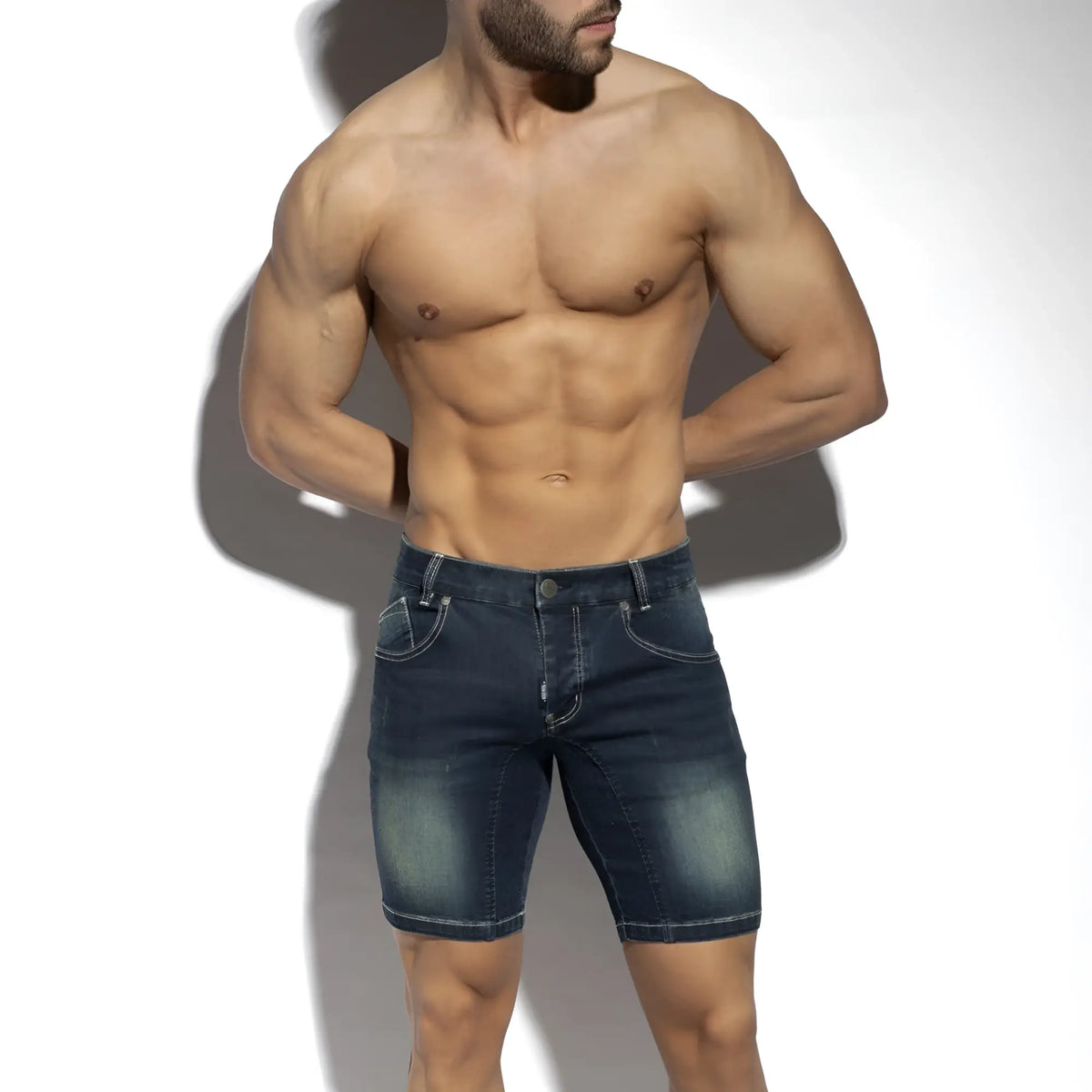 Dark blue denim bermuda jeans shorts with faded wash and classic stitching in new denim style