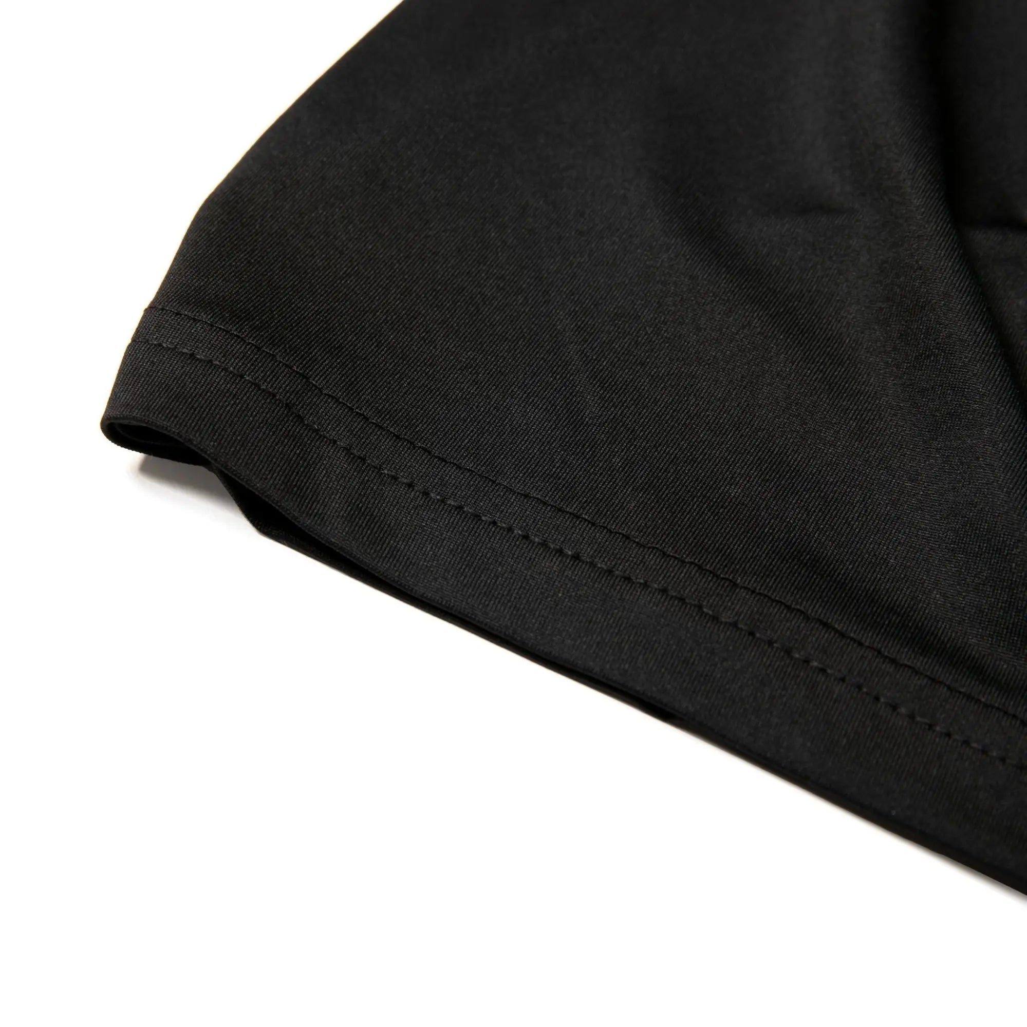 Black nylon active underwear crew neck t shirt sleeve with neatly stitched hem showing durable craftsmanship