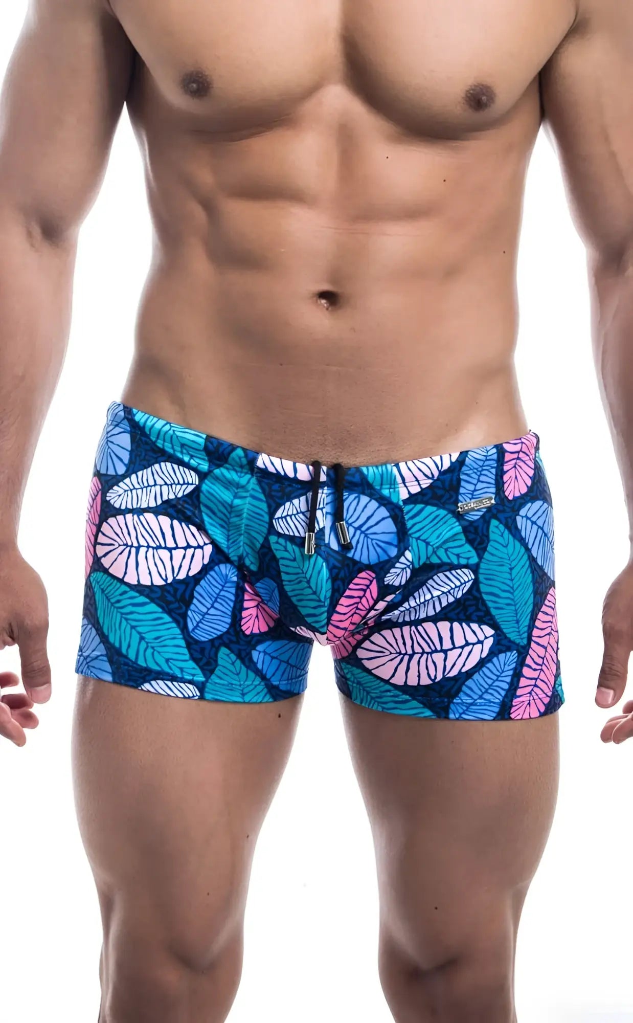 Oceanico square cut swim trunks with blue and pink leaf pattern on dark blue base perfect for beachwear