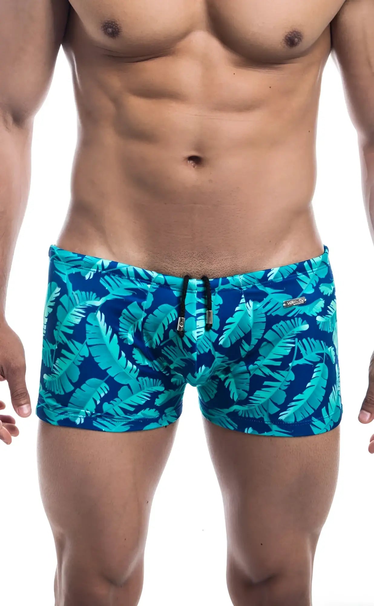 Oceanico square cut blue swim trunks with vibrant turquoise tropical leaf pattern for beach and swimwear use