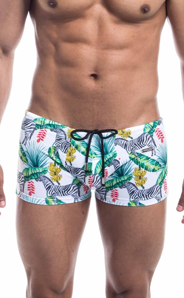 Oceanico square cut white swim trunks with vibrant tropical print featuring zebras green palm leaves red flowers and black drawstrings