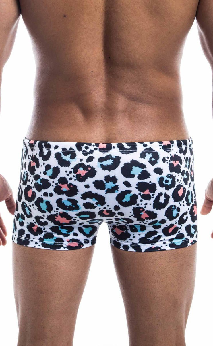 Oceanico square cut white swim trunks with bold leopard print featuring black teal and pink spots